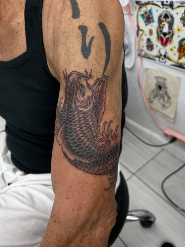 Bold Negative Space tattoo by Tiki (Christian Ramos) at Ohana Tattoo Waikiki, Hawaii — work #06
